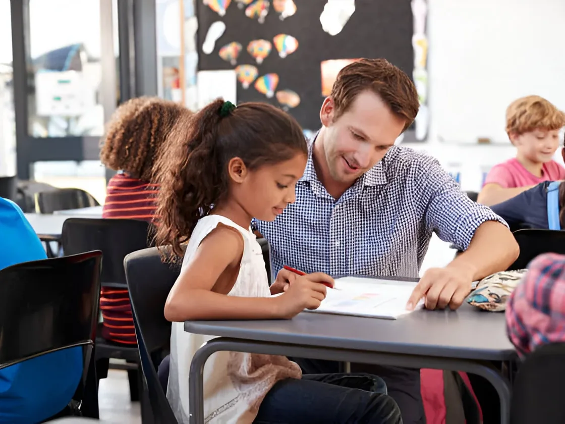 A tutor working one-to-one with a student